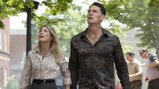 Emilia Harcourt #2 and Chris Smith #1 looking up in Peacemaker season 2 episode 3