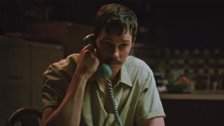 Bill Skarsgaard talking on the phone in Dead Man's Wire