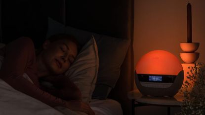 Best sunrise alarm clocks: A Philips alarm clock on a bedside table