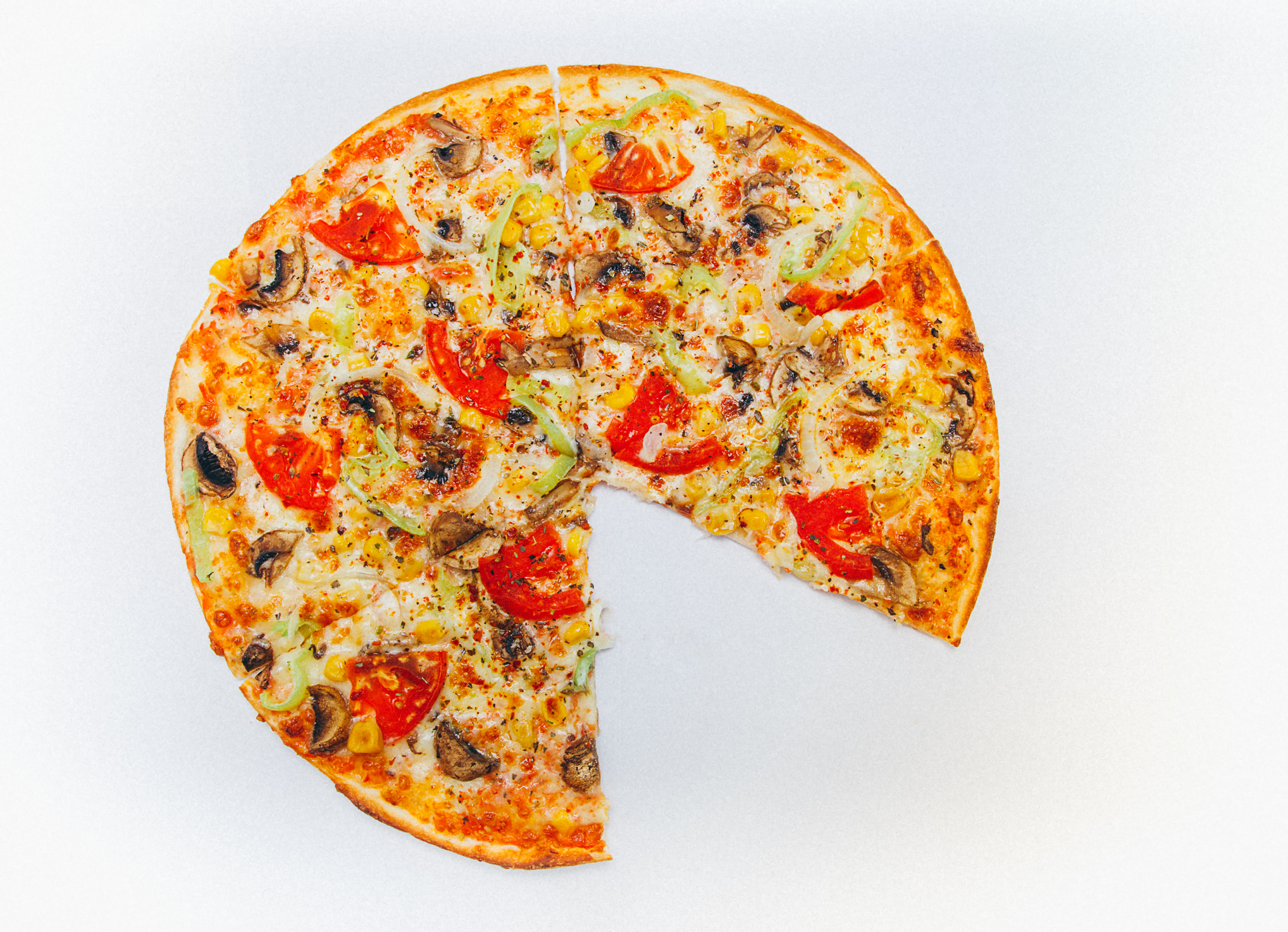 Picture of mixed Italian style pizza without one piece isolated on white