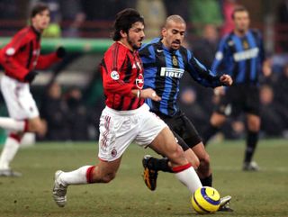 AC Milan's Gennaro Gattuso up against Inter's Juan Sebastian Veron in a derby in 2005.