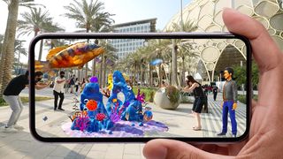 What skills to artists need for real time VFX; a person holds up a phone displaying AR content