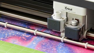 Best Cricut materials; a digital craft cutting machine trims a material