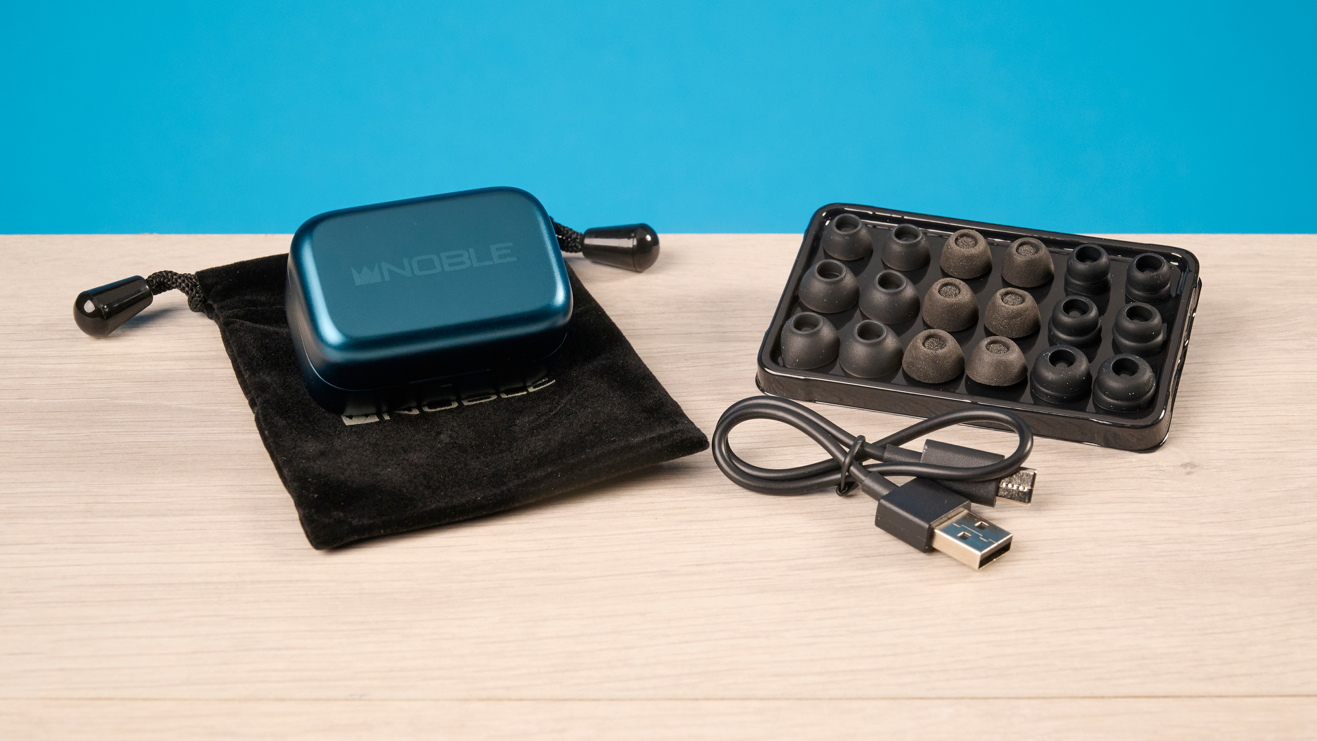 A pair of Noble Audio Osprey wireless earbuds