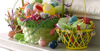 Colorful baskets filled with painted eggs for a creative Easter decor mantel idea