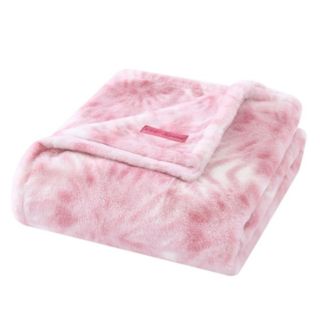 A pink fluffy tie-dye patterned throw