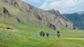 Horse riding in Kurumduk valley, Naryn province, Kyrgyzstan