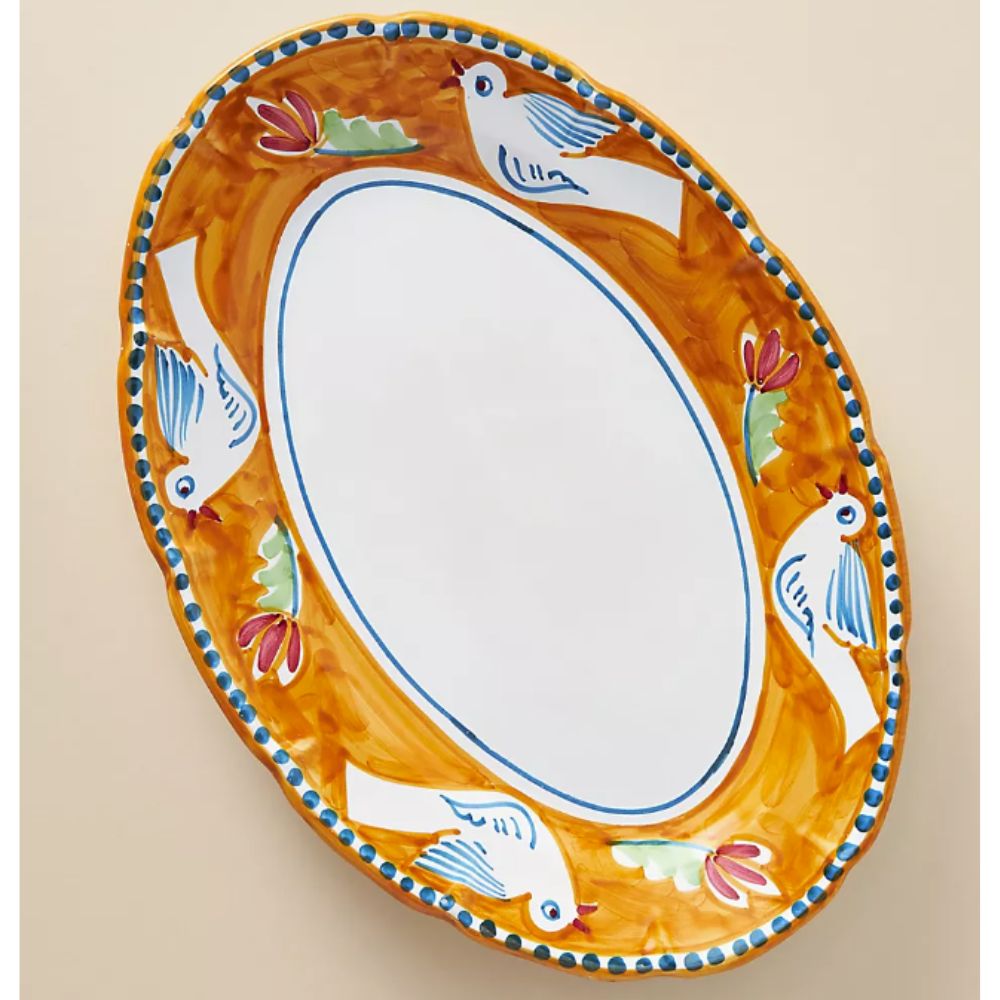 Large oval platter with orange rim and painted birds and flowers
