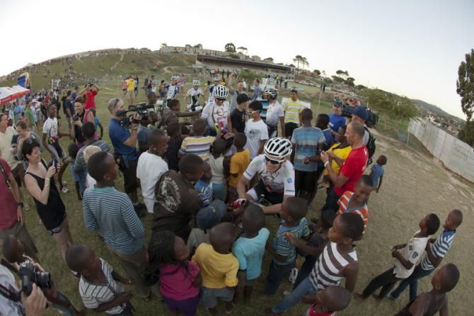 Christoph Sauser is swarmed by fans after his win