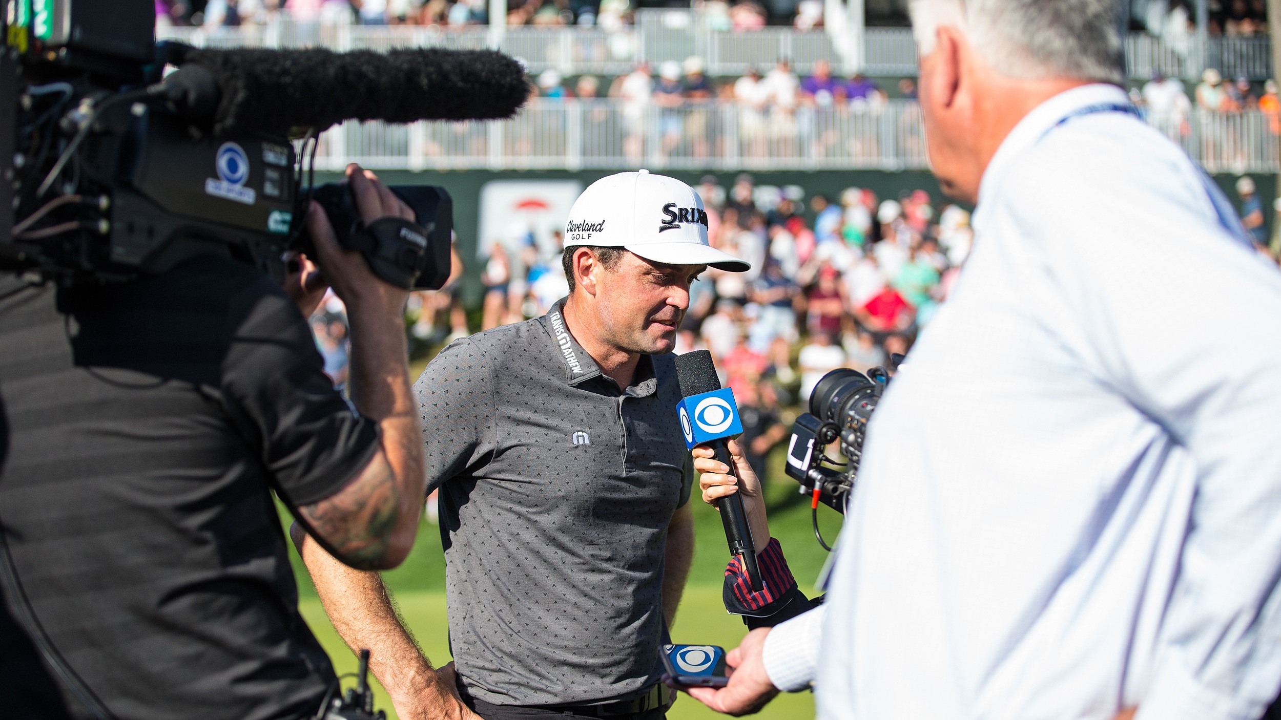 Keegan Bradley being interviewed by TV on the golf course