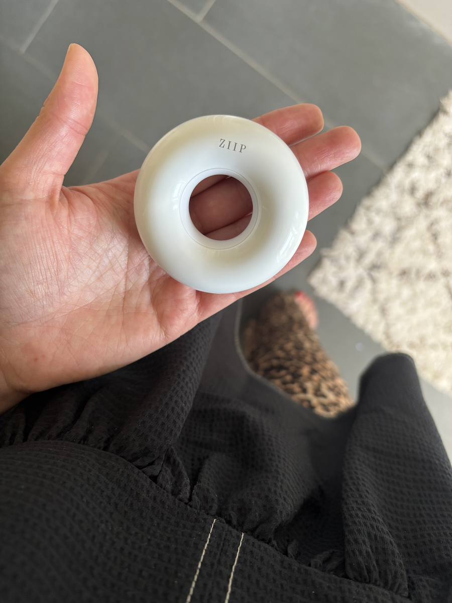 Mica Ricketts holding Ziip Dot in palm of hand