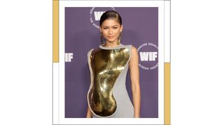 Zendaya wears a large gold breast and body plate with a grey dress as she attends Women in Film's Annual Award Ceremony at The Academy Museum of Motion Pictures on October 06, 2021 in Los Angeles, California.
