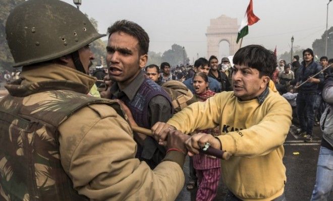 Delhi police try to disperse demonstrators protesting after the gang-rape of a 23-year-old woman.