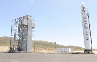 A Minotaur 4 rocket stands beside Space Launch Complex-8 here Wednesday, Aug. 3, 2011. The Minotaur 4 will carry DARPA's hypersonic HTV-2 aircraft scheduled to launch from California's Vandenberg Air Force Base in August 2011.