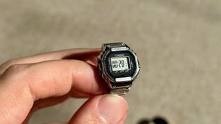 A close-up of the Casio CRW001-1 ring watch on the stopwatch setting