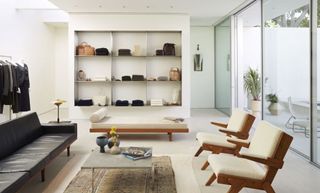 Room with shelves and wooden chairs