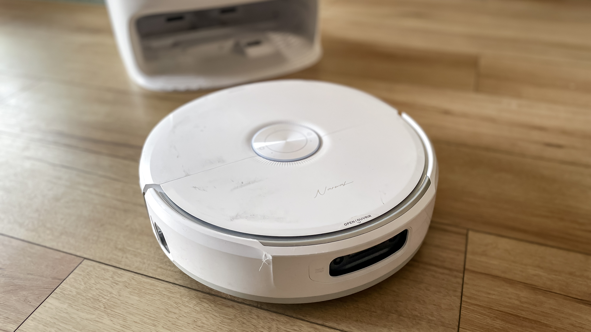 Narwal Freo 20 robot vacuum on a kitchen floor