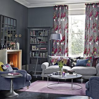 living room with grey wall and curtains on window