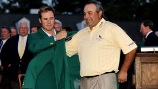 Angel Cabrera is given the Green Jacket by Trevor Immelman after the 2009 Masters