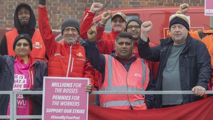 Royal Mail workers and members of the CWU on the picket line