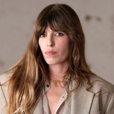 Lou Doillon wears a beige trench coat