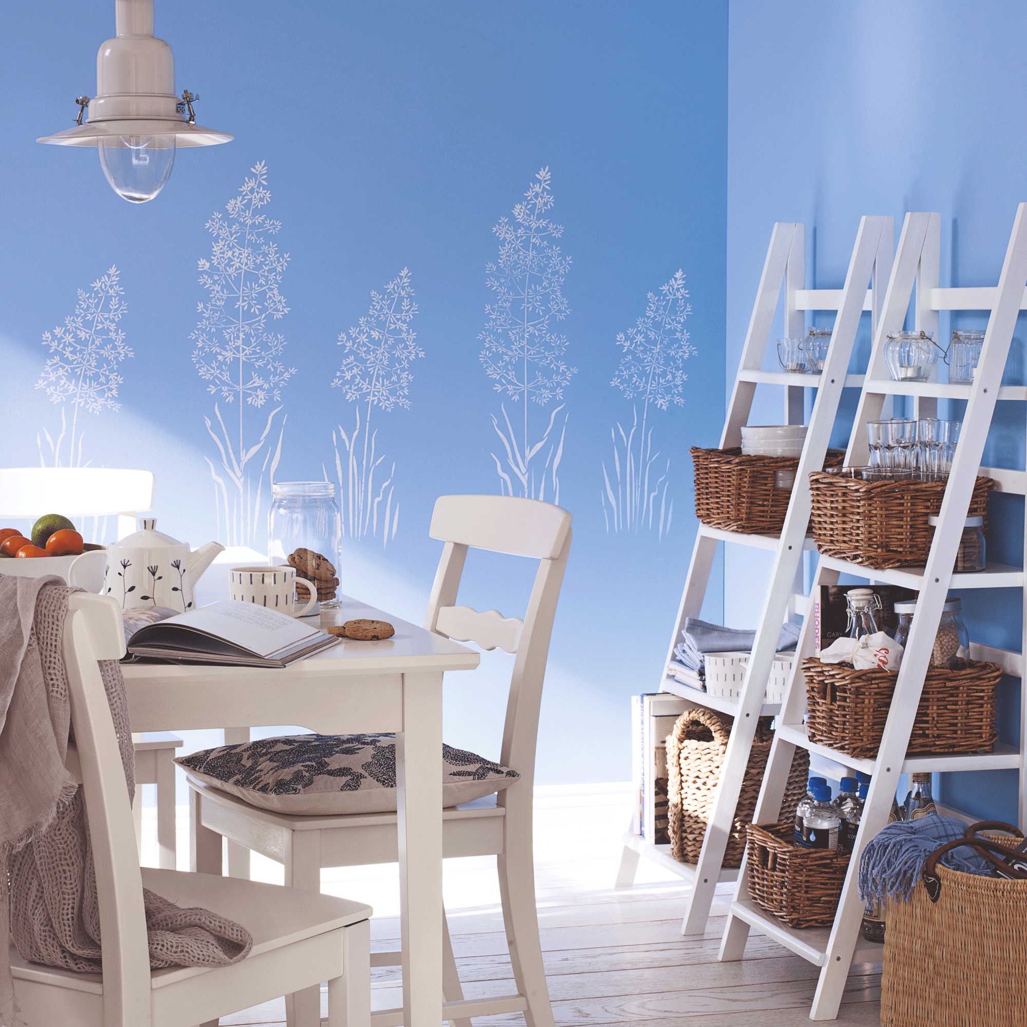Blue dining room with white chairs and shelves