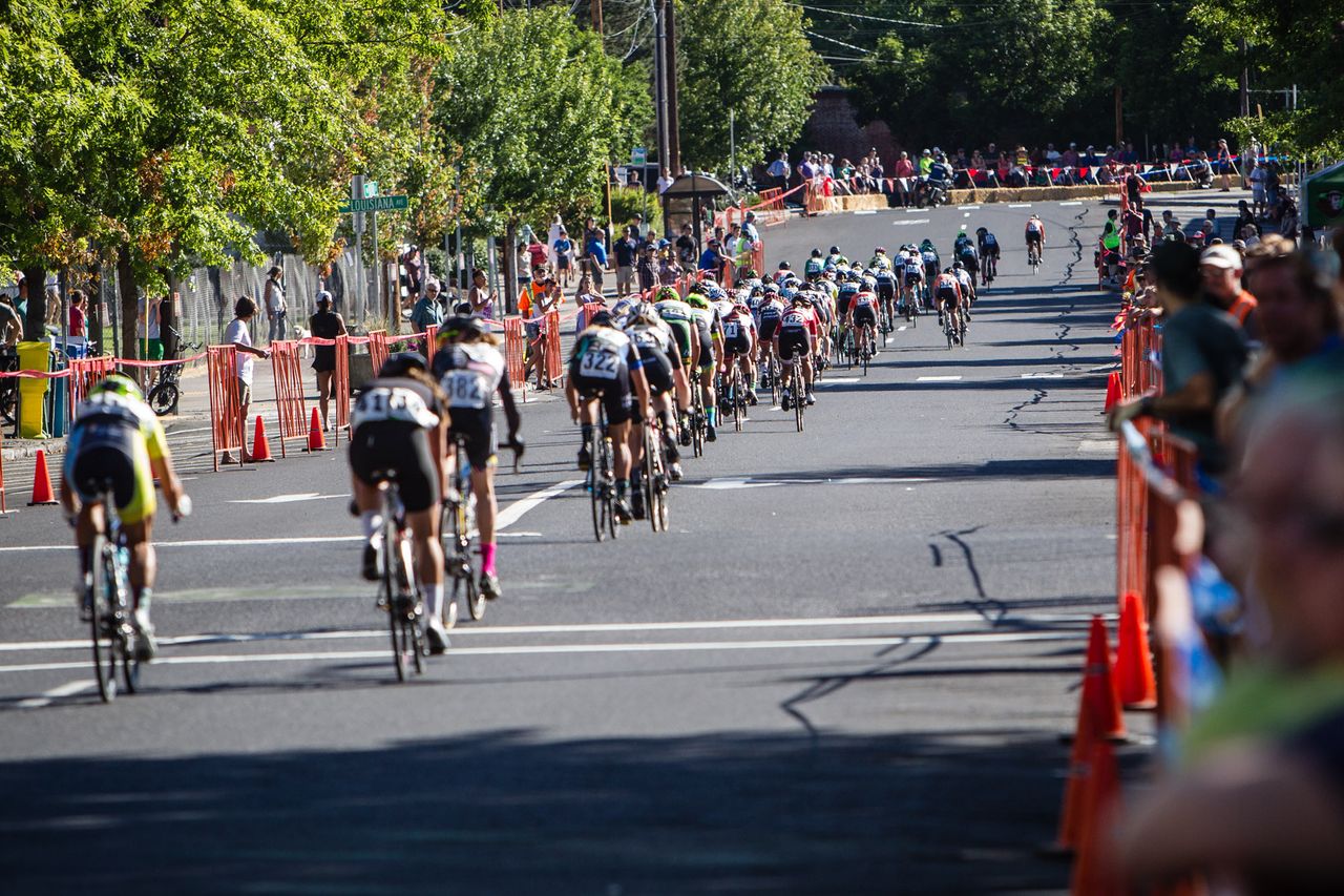 The womens field gets strung out along the back side of the course.