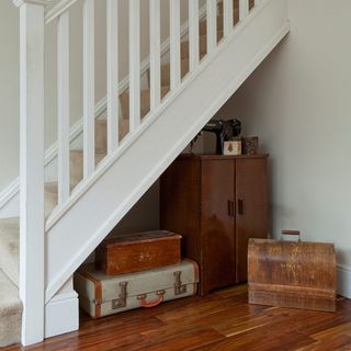 white stairway with wooden flooring