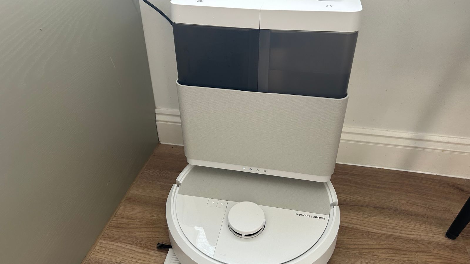 Roomba 505 Plus sitting on dock in white