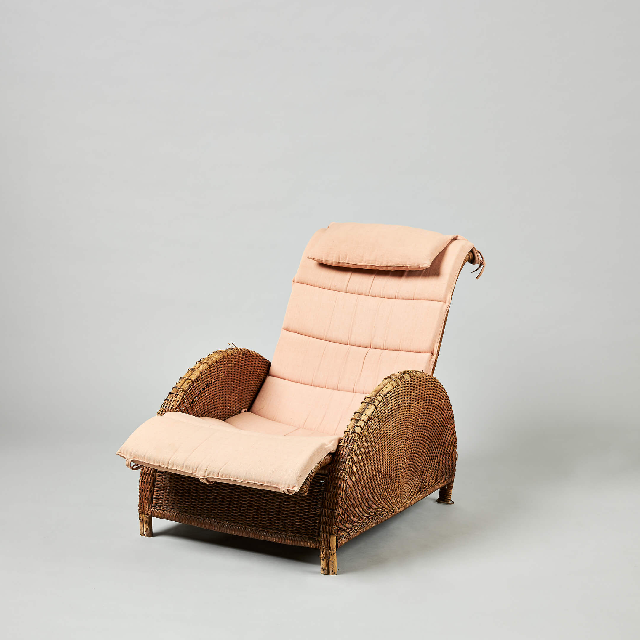 Paris chair by Arne Jacobsen, a rattan chair with peach coloured cushion