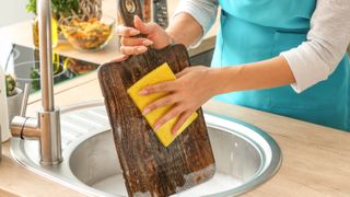 Hand washing a wooden cutting board