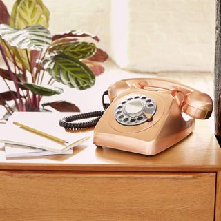 telephone with rode gold colour