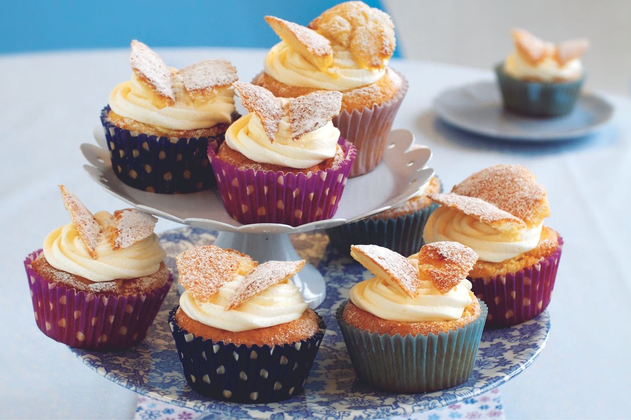 Butterfly bun cakes stacked on a plate