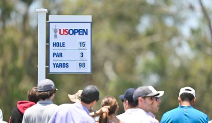 A sign reading par 3 98 yards at the US Open