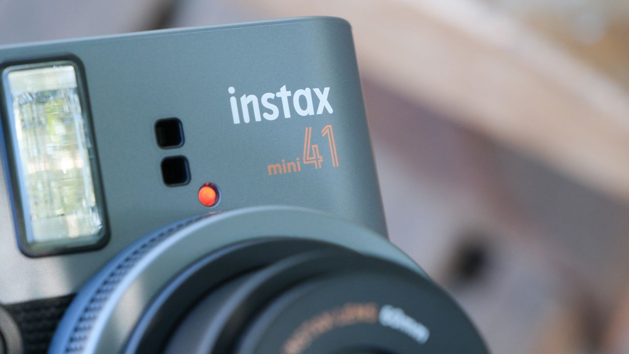 Close up of the branding on a Fujifilm Instax Mini 41 camera