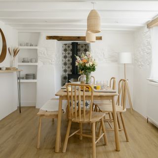 Dining area with natural tones and a wooden table and chairs