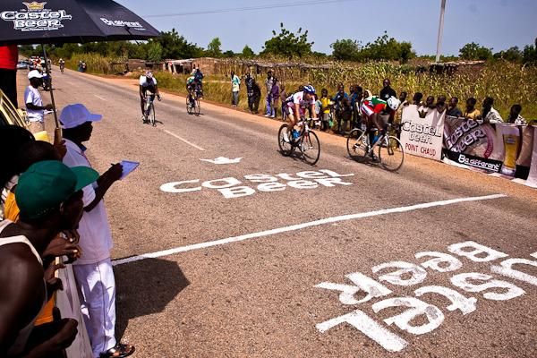 A Burkina rider takes the intermediate sprint from the 7-man breakaway.