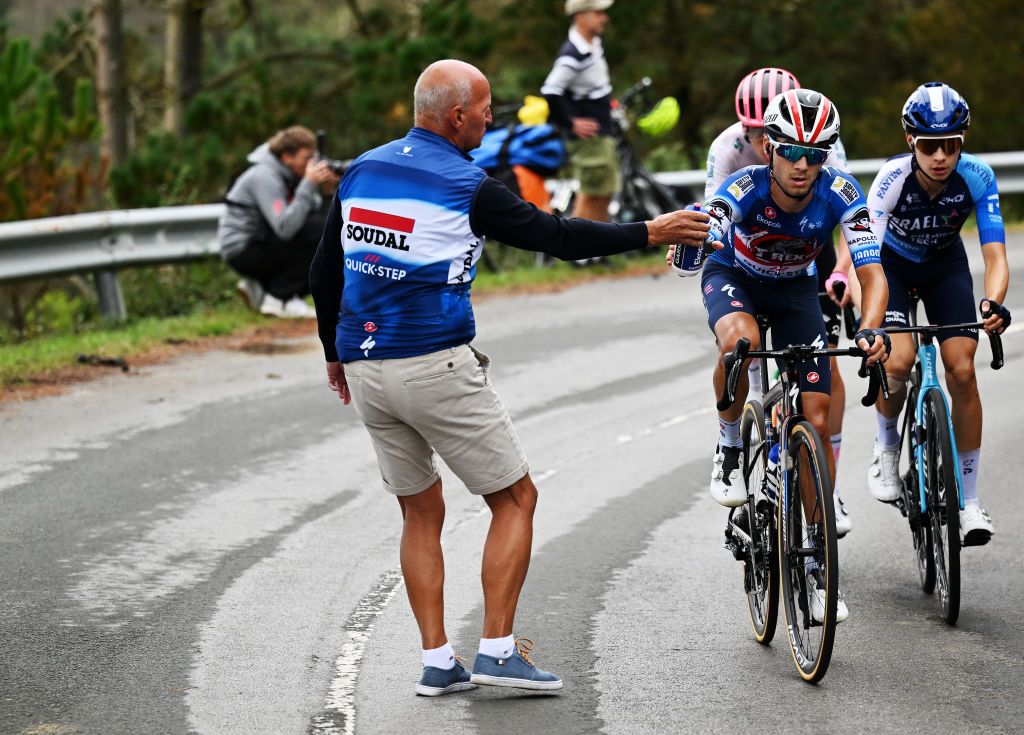 LAGOS DE COVADONGA SPAIN SEPTEMBER 03 The Soigneur wait for the William Junior Lecerf of Belgium and Team TRex Quick Step in the feeding area during the La Vuelta 79th Tour of Spain 2024 Stage 16 a 1815km stage Luanco to Lagos de Covadonga 1069m UCIWT on September 03 2024 in Lagos de Covadonga Spain Photo by Tim de WaeleGetty Images
