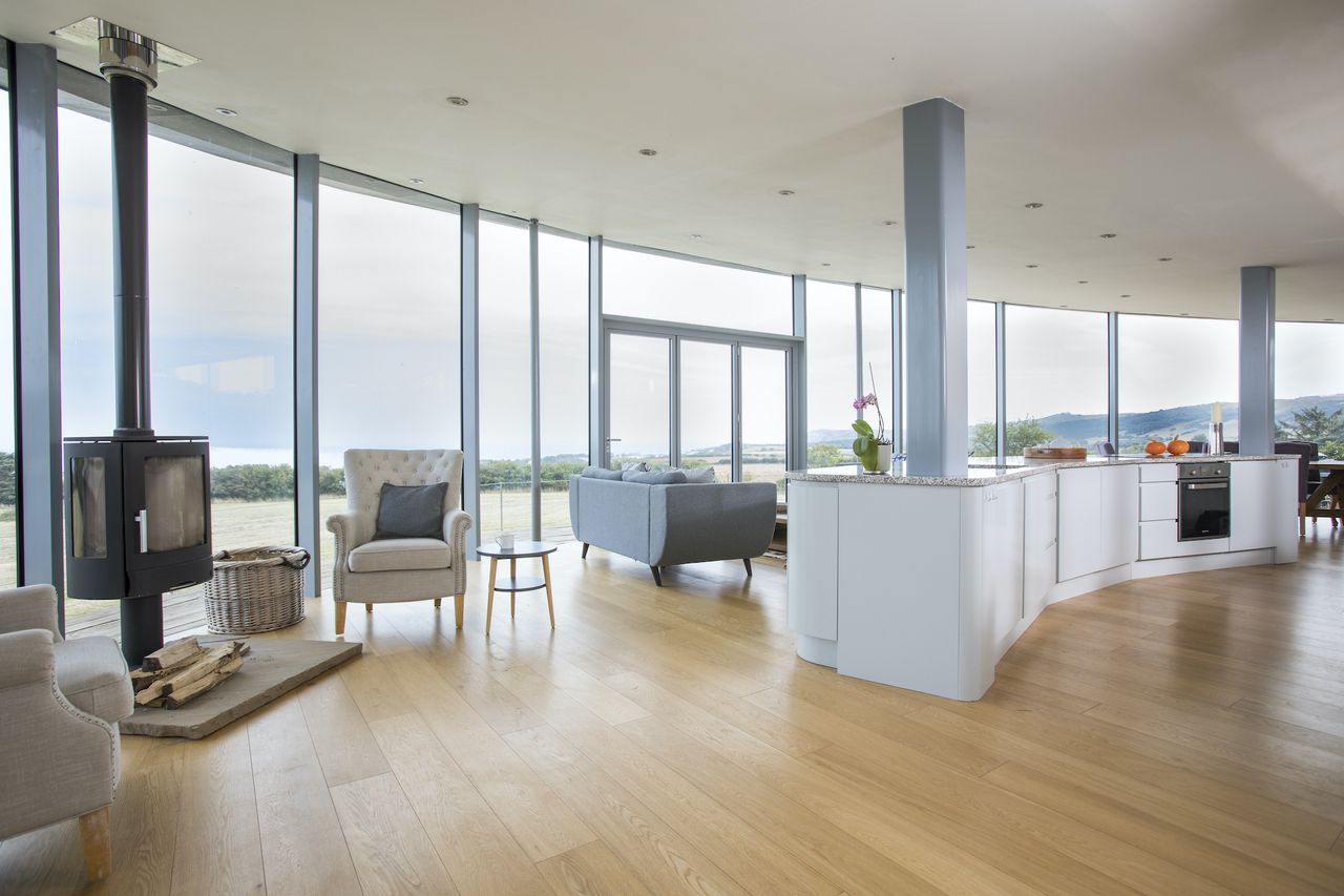 self build home with timber cladding and open plan space and glazing