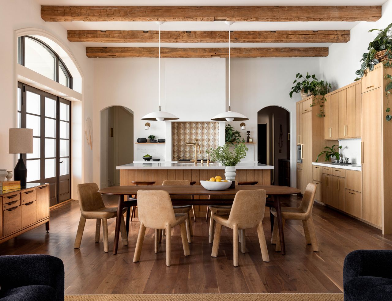 a white oak kitchen with an island and dining table