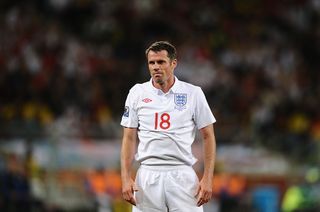 England's defender Jamie Carragher reacts after being handed a yellow card by Uzbek referee Ravshan Irmatov (unseen) during the Group C first round 2010 World Cup football match England vs. Algeria on June 18, 2010 at Green Point stadium in Cape Town. NO PUSH TO MOBILE / MOBILE USE SOLELY WITHIN EDITORIAL ARTICLE - AFP PHOTO / JEWEL SAMAD (Photo credit should read JEWEL SAMAD/AFP via Getty Images)