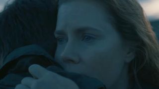 Amy Adams hugging Jeremy Renner in a screenshot from Arrival.