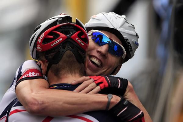 Lotto Belisol's Marcel Sieberg congratulates teammate Andre Greipel after his stage victory in Saint-Quentin.