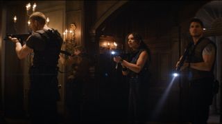 Tom Hopper, Chad Rook, Hannah John-Kamen, and Robbie Amell checking out the mansion lobby in Resident Evil: Welcome To Raccoon City.