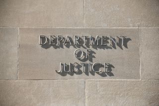 Department of justice sign on a building