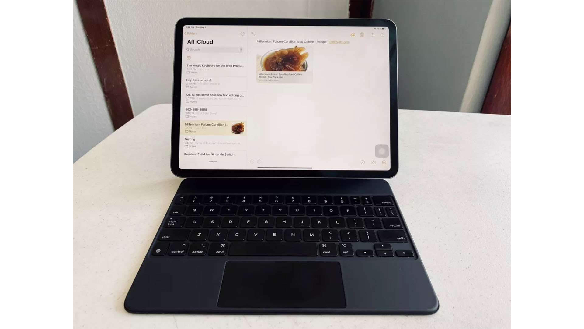 An iPad Pro on a desk with a Magic Keyboard attached to it.