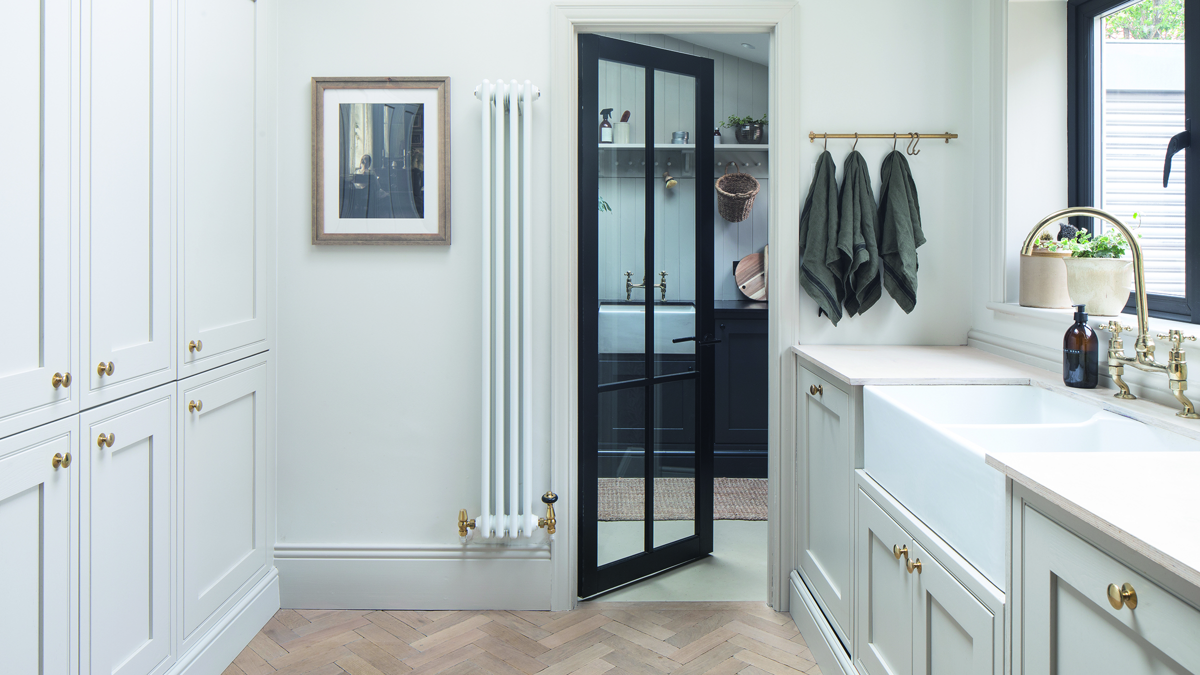 Utility room with cream shaker doors