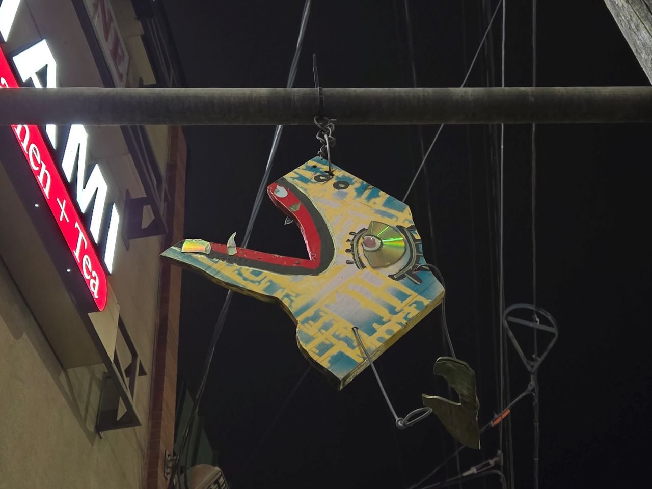 A piece of art hanging from a pole