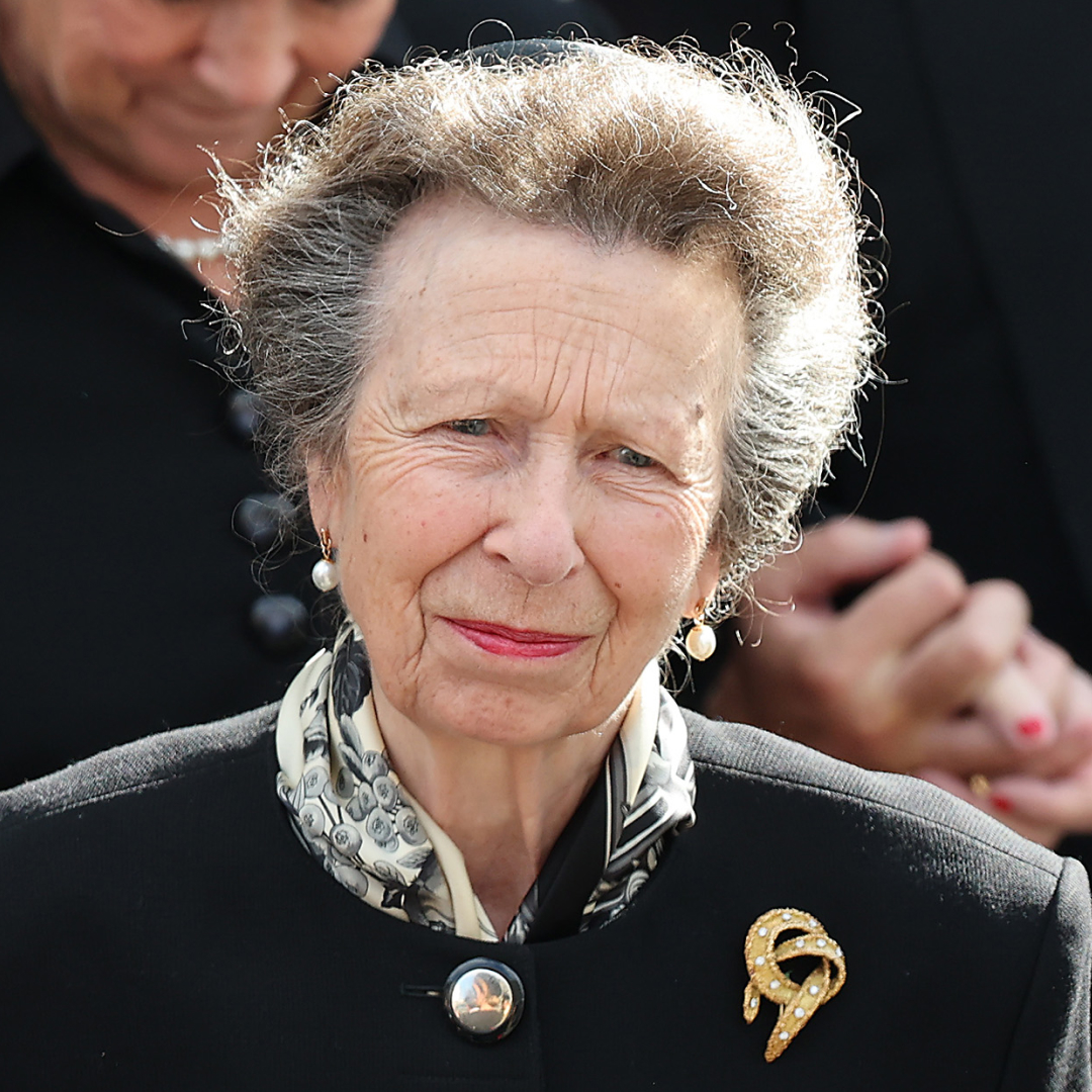 Princess Anne wearing a black coat and brooch