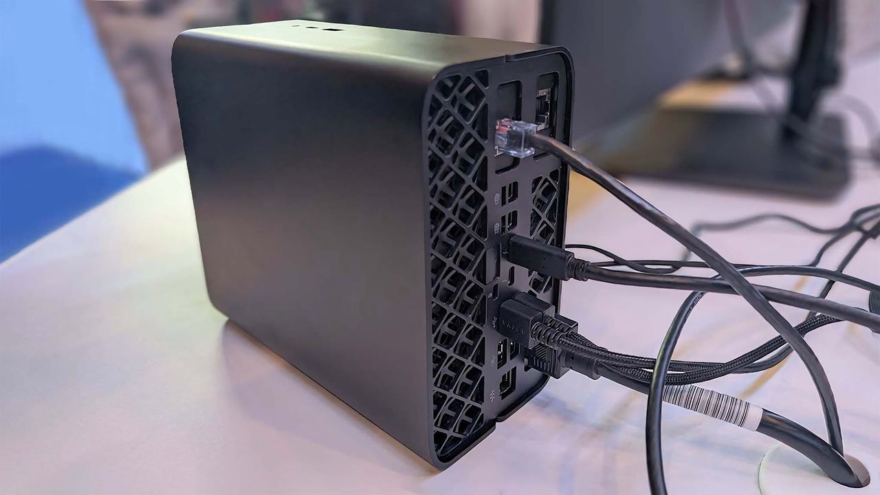 Backside view of the HP Z2 Mini G1a with various cables connected to the ports.